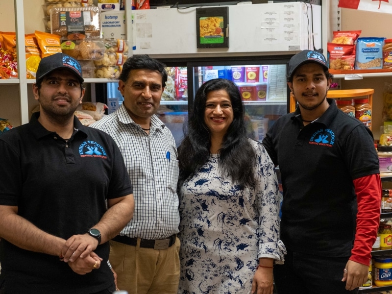 The Khera family inside their small grocery store.