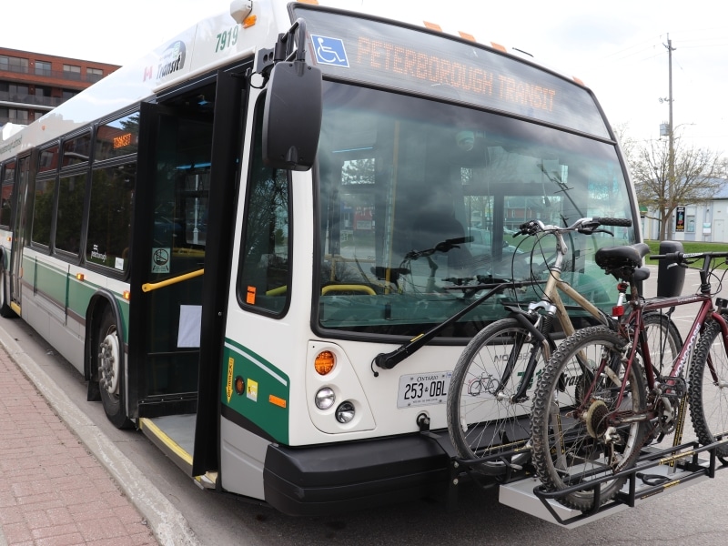 Photo of a parked Peterborough Transit bus with two bikes on the front.