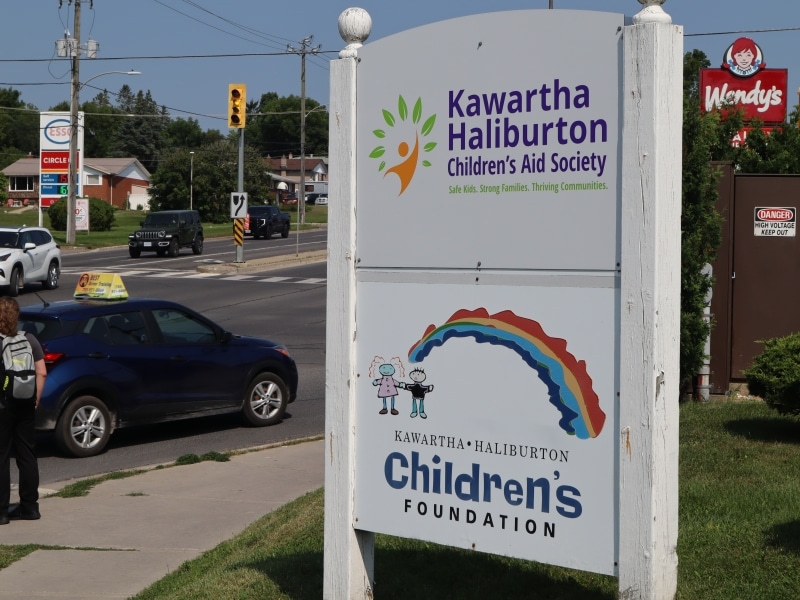 Photo shows the sign for the Kawartha Haliburton Children's Aid Society outside the agency's office on Chemong Road, Peterborough.